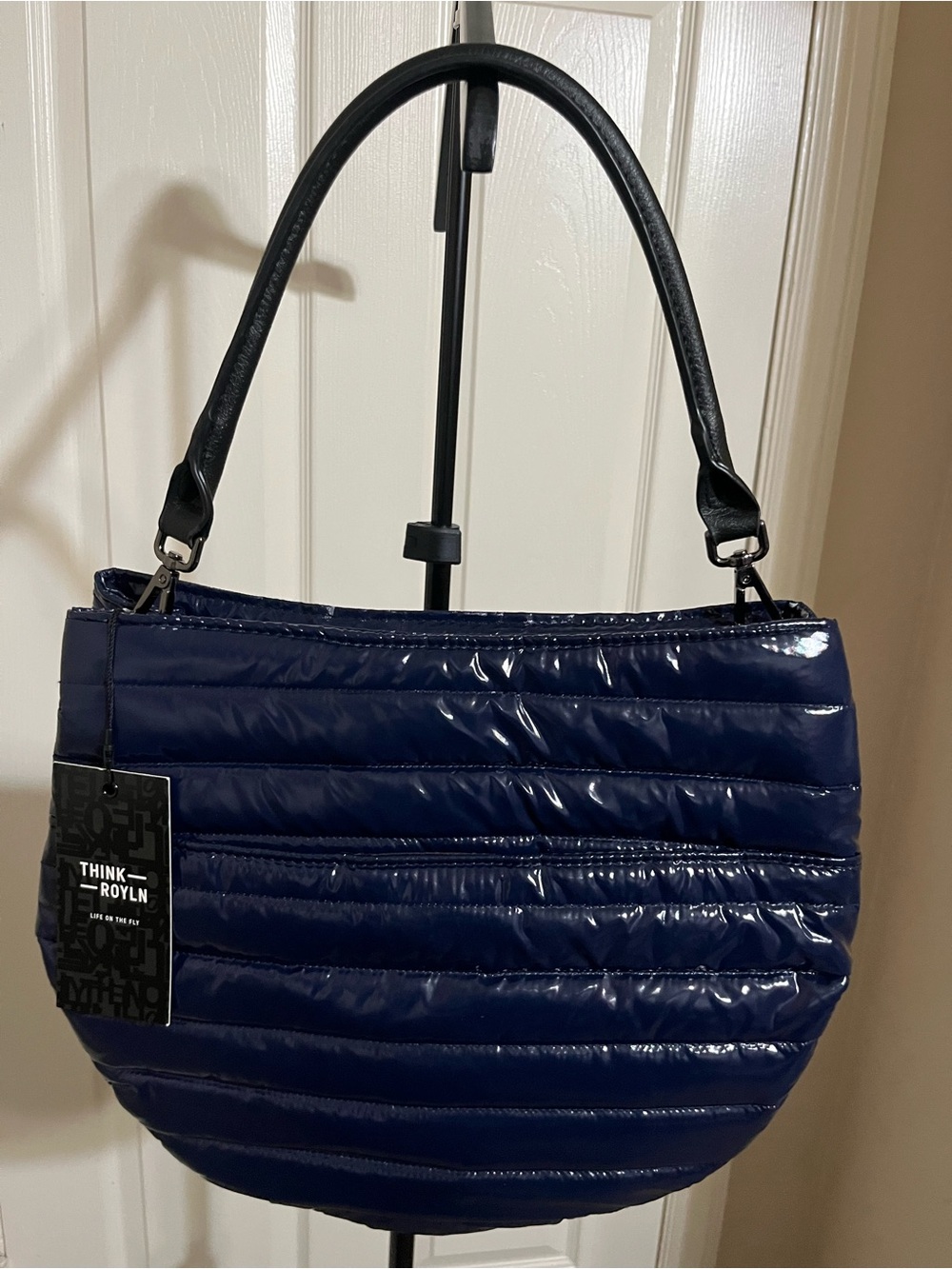 THINK ROYLN Navy Quilted Gloss Shoulder Bag with Black Straps